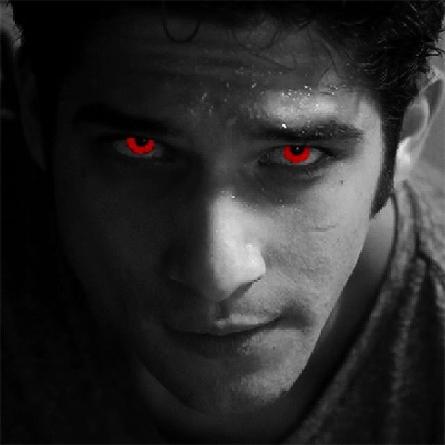 a man with red eyes looking at the camera