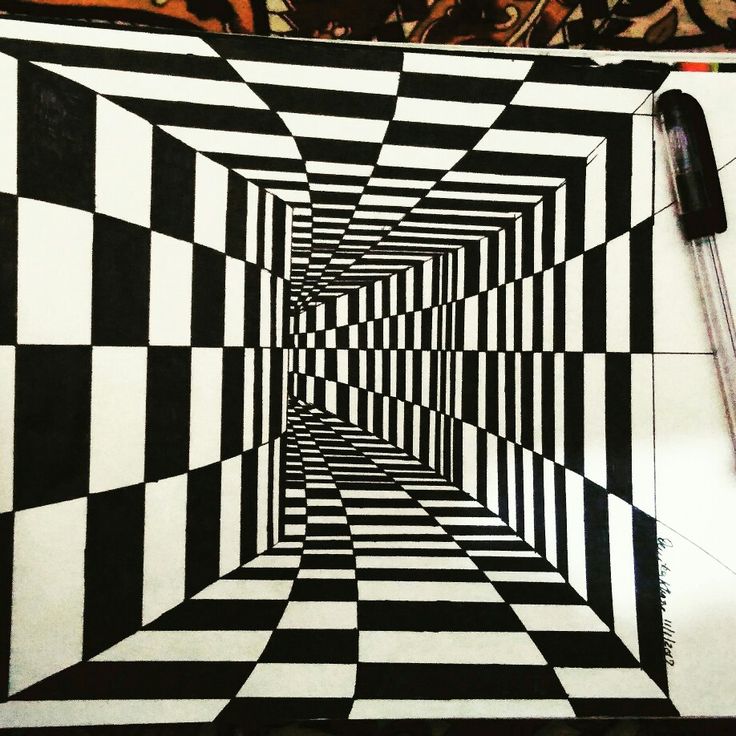 a black and white checkered floor with a pen on it