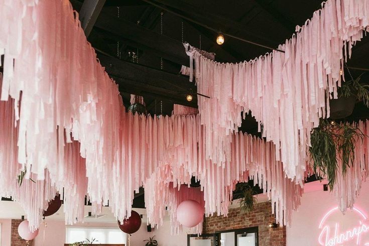 pink icing hanging from the ceiling in a restaurant