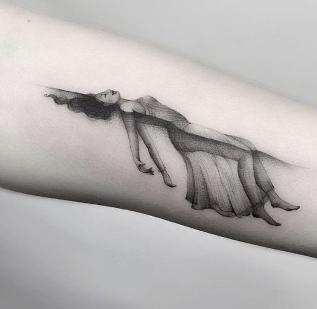 a woman's arm with a tattoo on it