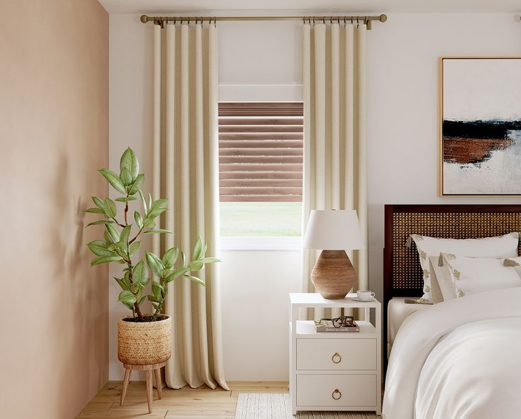 a bedroom with white bedding and beige drapes on the window sill, potted plant next to it