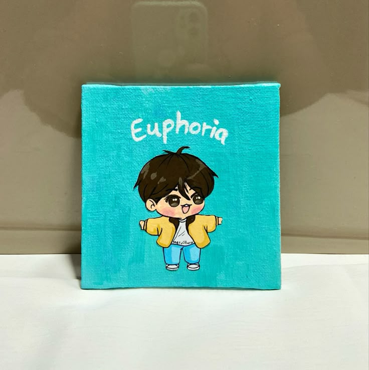 a small blue box with a cartoon boy on it's front and the words euphora written in white