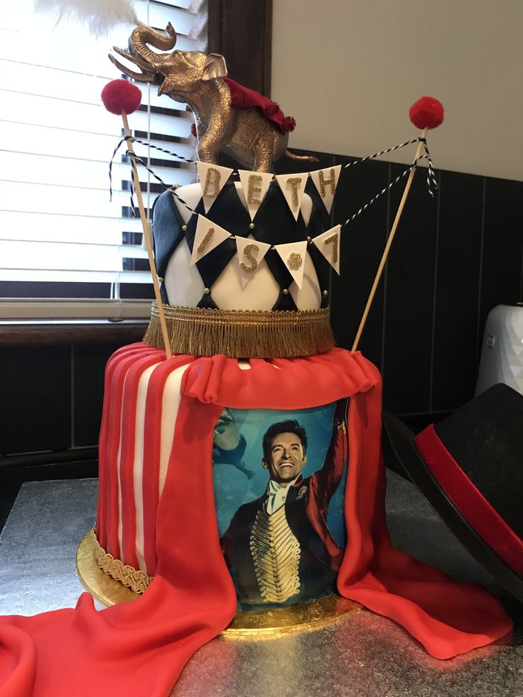 a three tiered cake with an image on it