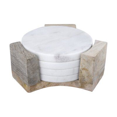 a white marble and wood stool with four stacked blocks on the top, viewed from above