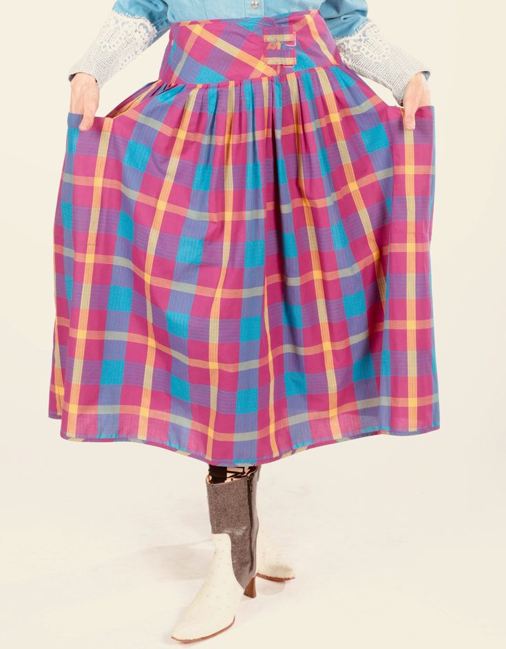 "80's Plaid Skirt/ Plaid Cotton Skirt/ Full Plaid Skirt/ Madras Skirt/ Summer Plaid Skirt/ Long Plaid Skirt/ Plaid Prairie Skirt Darling cotton skirt by Santa Cruz, San Francisco, Ca. Velcro waist attachment. Large side pockets. Soft light cotton. Original size tag reads size 7. Model is 5'4\" and a size 4 for scale. Please see exact measurements below.  Item measured while flat, double where applicable, i.e. waist, hips. Waist 14\" Hips 24\" Skirt length 30\" 100% cotton. Made in Taiwan. Denim blouse also available at https://www.etsy.com/listing/1422139842/banjo-dallas-texas-southwest-lace-blouse?" Vintage Purple Lined Skirt, Multicolor Long Skirt For Fall, Retro Long Lined Skirt, Retro Long Skirt With Lining, Fall Multicolor Skirt With Elastic Waistband, Multicolor Skirt With Elastic Waistband For Fall, Plaid Skirt With Pockets, Retro Flowy Lined Skirt Bottoms, Retro Flared Skirt With Pockets