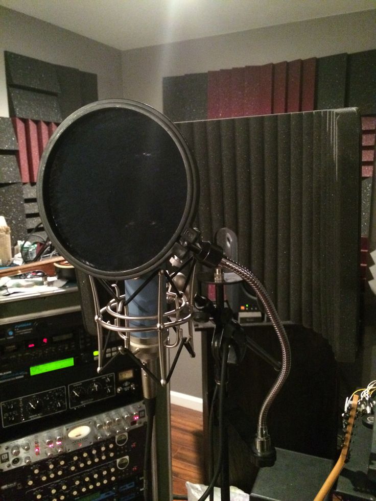 a recording studio with microphones and sound equipment