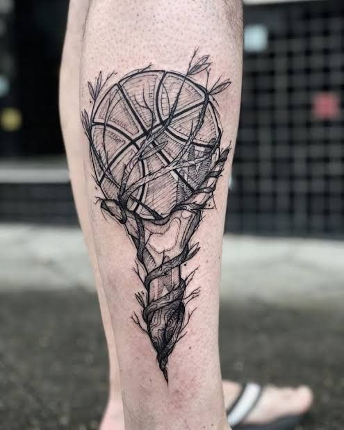 a man's leg with a tattoo on it and an arrow in the center