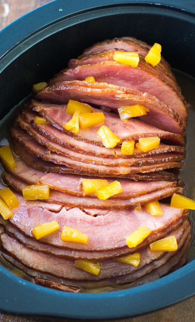 ham and pineapples are cooked in the slow cooker