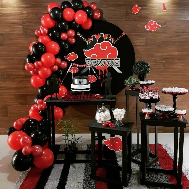 a black and red party with balloons