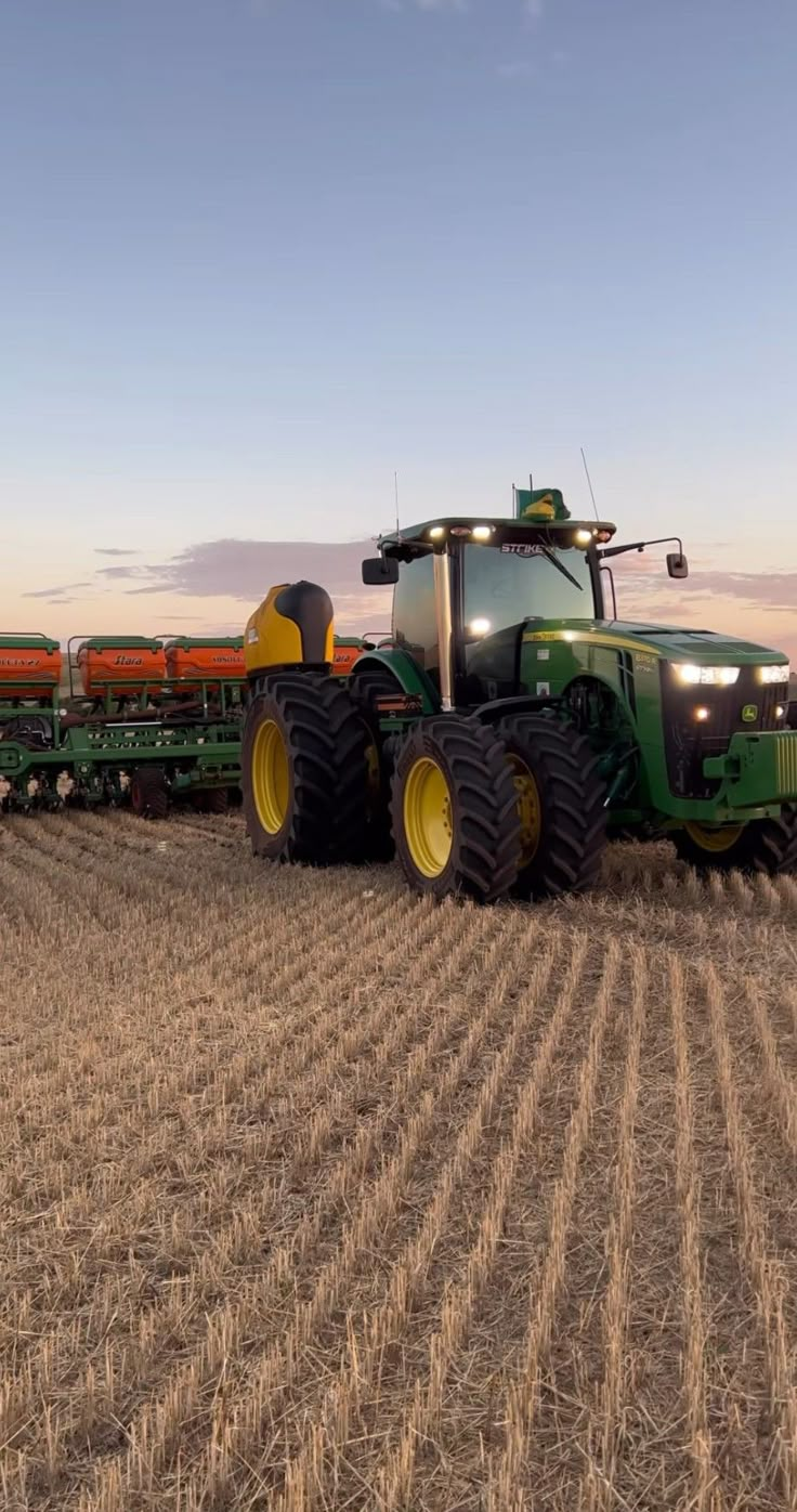 a large tractor is driving in the middle of a field