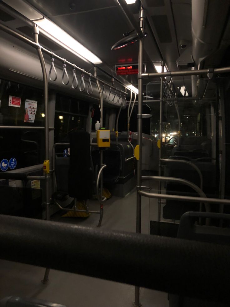 the interior of a public transit bus at night