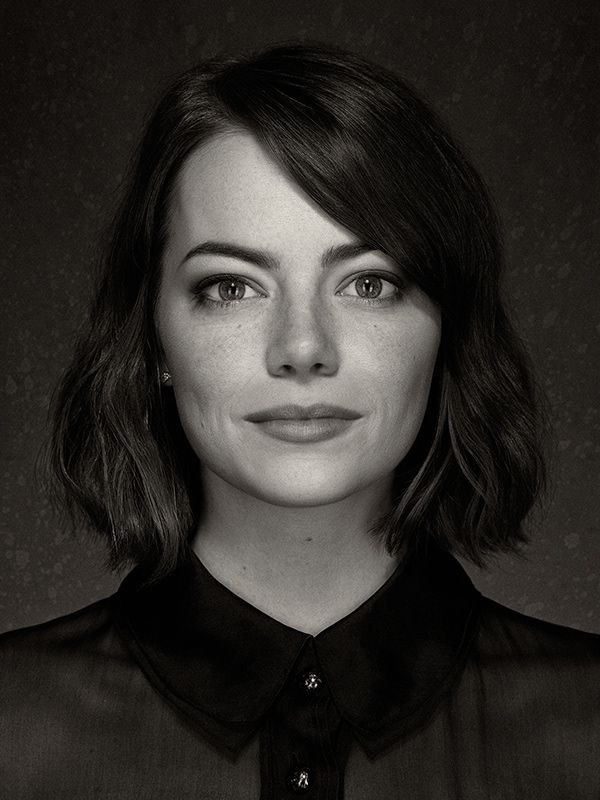 a black and white photo of a woman with shoulder length hair, wearing a shirt