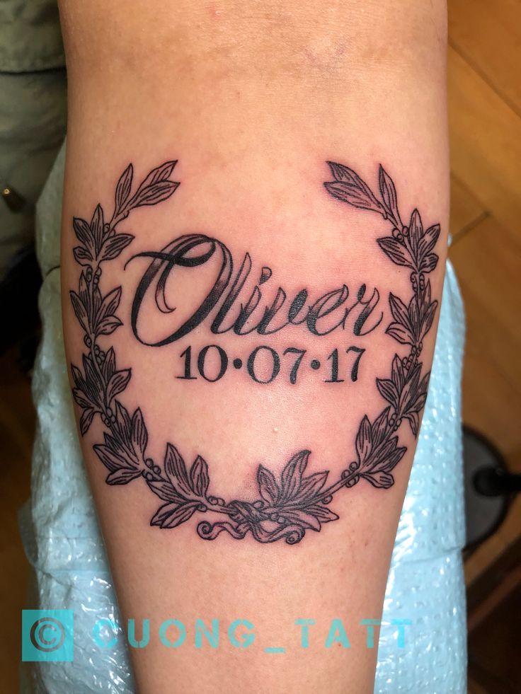 a woman's arm with a tattoo on it that says, queen 10 01 11