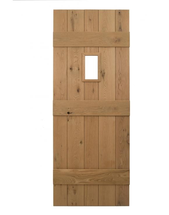 a wooden door with a square window in the middle