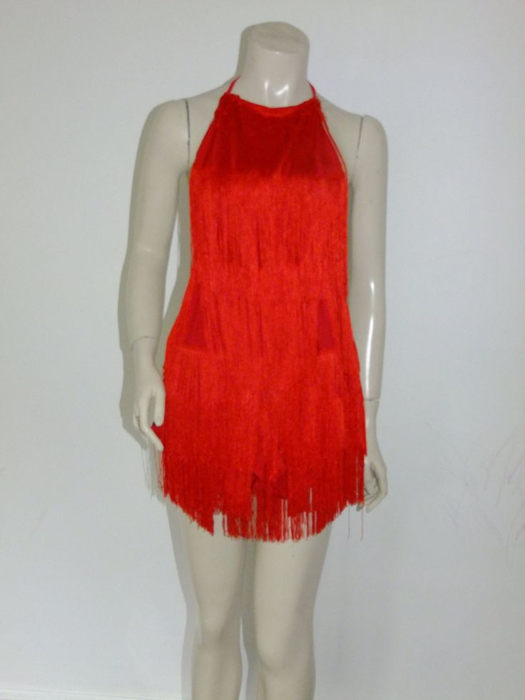 Super cute play suit covered in silky red fringing!  Estimated date Y2K i.e. the years between 1998 approx and 2004.  Great for stage presence, shaking and grooving on the dance floor, or just kicking up a storm!  Bright in bold red, the layers of silky fringing are set onto a stretch polyester type playsuit - ultra comfy, just climb in and go! There's an open / halter style back with ties to keep everything secure.    The base fabric is a lovely feel knit jersey with a weight to it.  No maker's Fitted Flapper Dress For Club In Summer, Sleeveless Flapper Dress For Club In Summer, Sleeveless Flapper Dress For Summer Clubbing, Red Halter Neck Mini Dress For Club, Fitted Red Flapper Dress For Parties, Red Fringe Party Dress, Red Fringed Party Dresses, Red Fringe Dress For Party, Red Summer Flapper Dress For Party