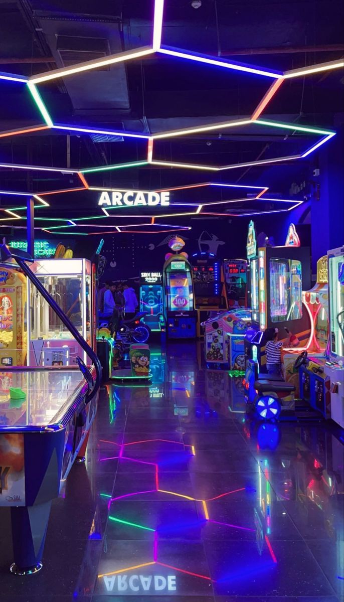 the arcade is brightly lit up with neon lights