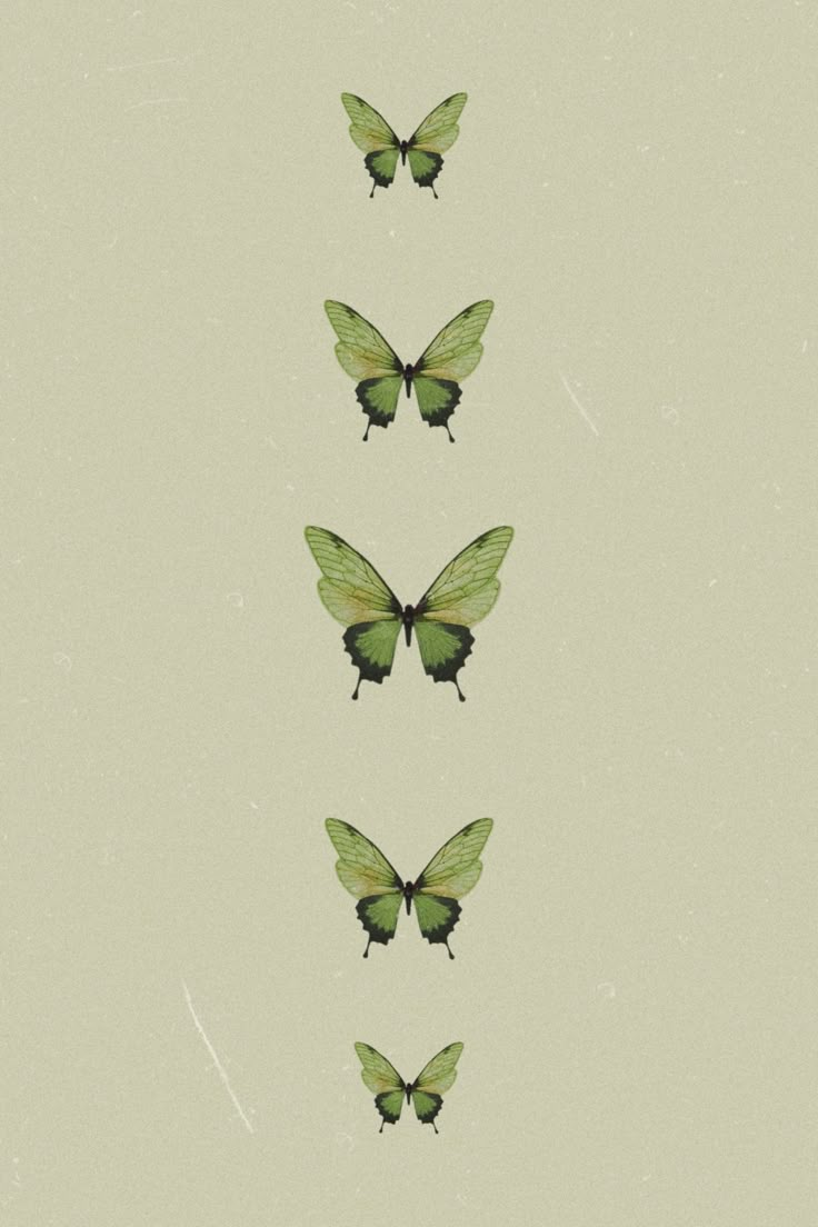 four green butterflies flying in the same direction