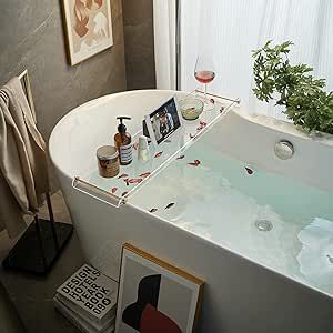 a bathroom with a large tub and pictures on the wall