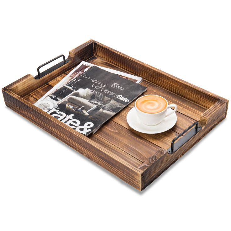 a wooden tray with a cup of coffee on it and a magazine in the middle