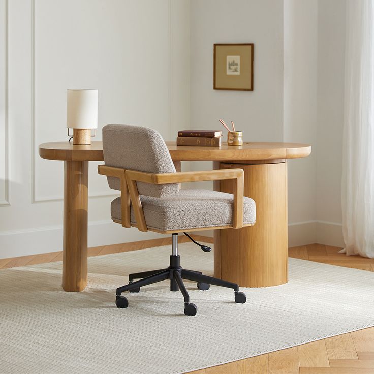 an office chair sitting at a desk with a lamp on the table next to it