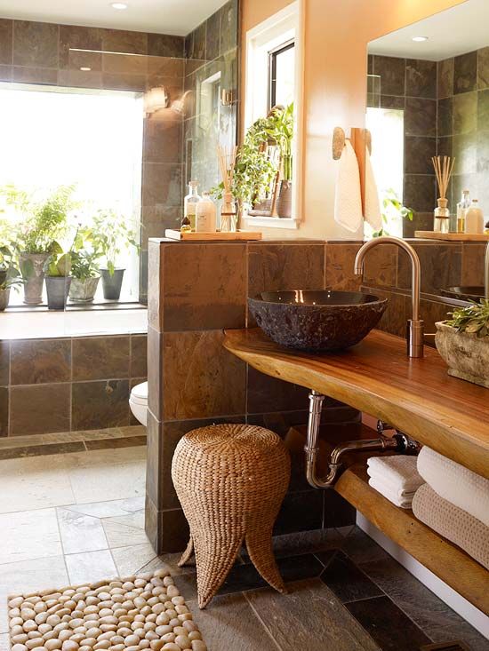 a bathroom with a sink, mirror and bathtub in it's center area