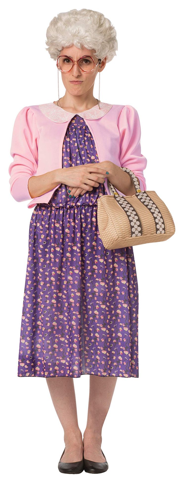 an old woman in a dress and hat holding a purse