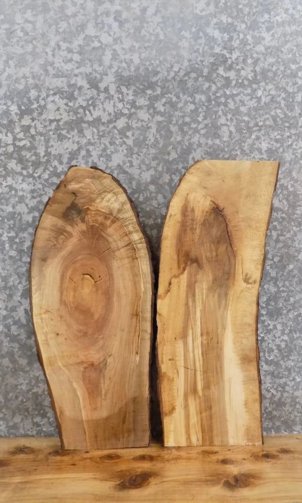 two pieces of wood sitting on top of a wooden table