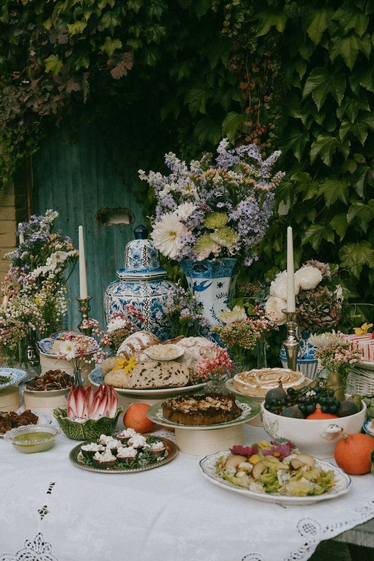 Very abundant buffet setting featuring antique blue vases, purple and white flower arrangements and lots of tasty food Baroque Party Decor, Baroque Wedding Theme, Art With Food, Baroque Wedding, Wedding Buffet, Baroque Design, Wedding 2025, Gathering Place, Wedding Aesthetic