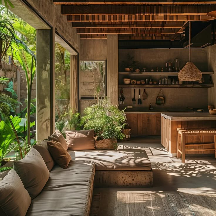 a living room filled with lots of furniture and plants