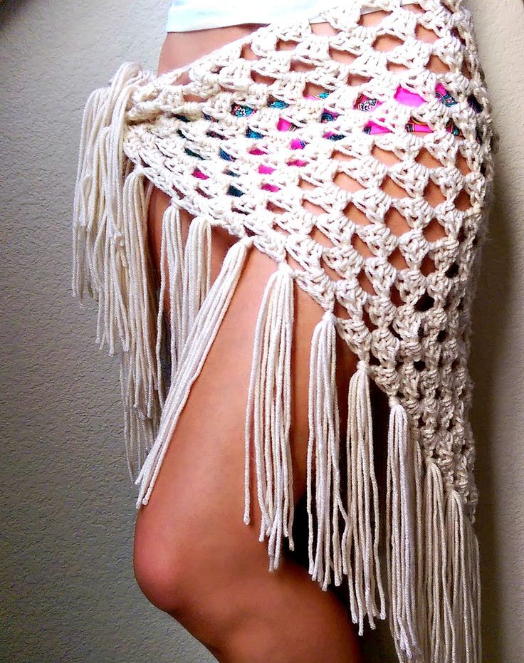 the back of a woman's dress with crocheted fringes on it