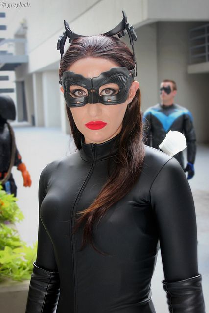 a woman wearing a catwoman mask and black catsuit