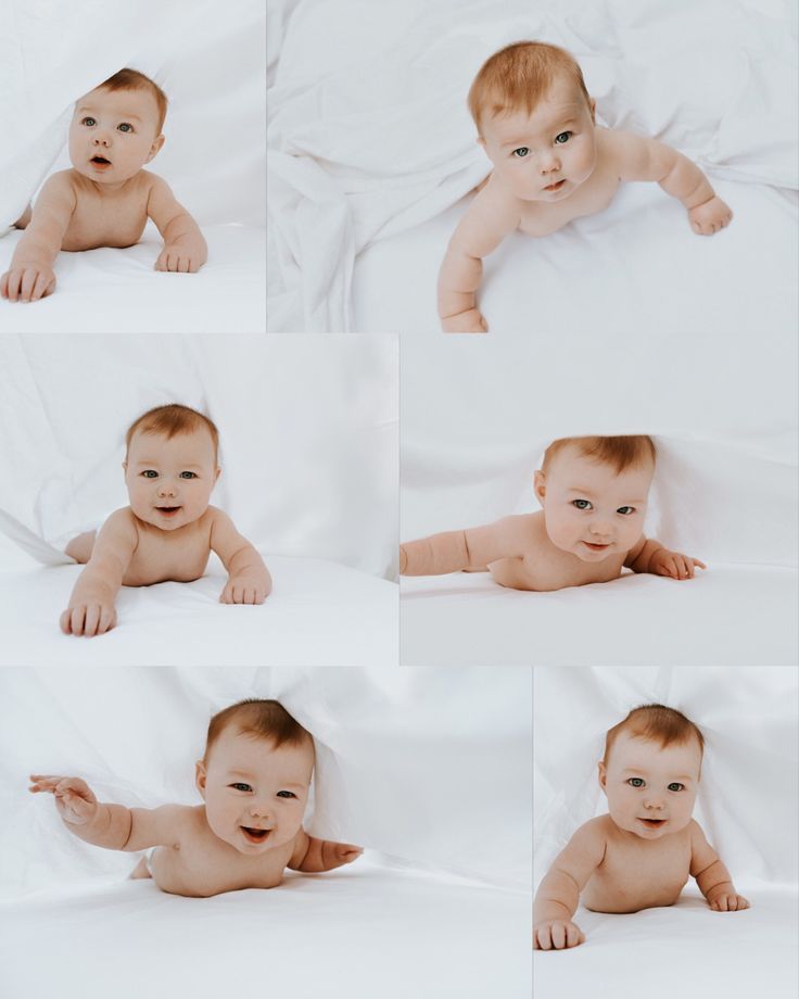 a baby is laying down on a white sheet