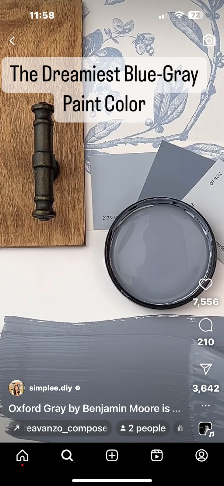 the blue gray paint color is next to a magnifying glass and some other items