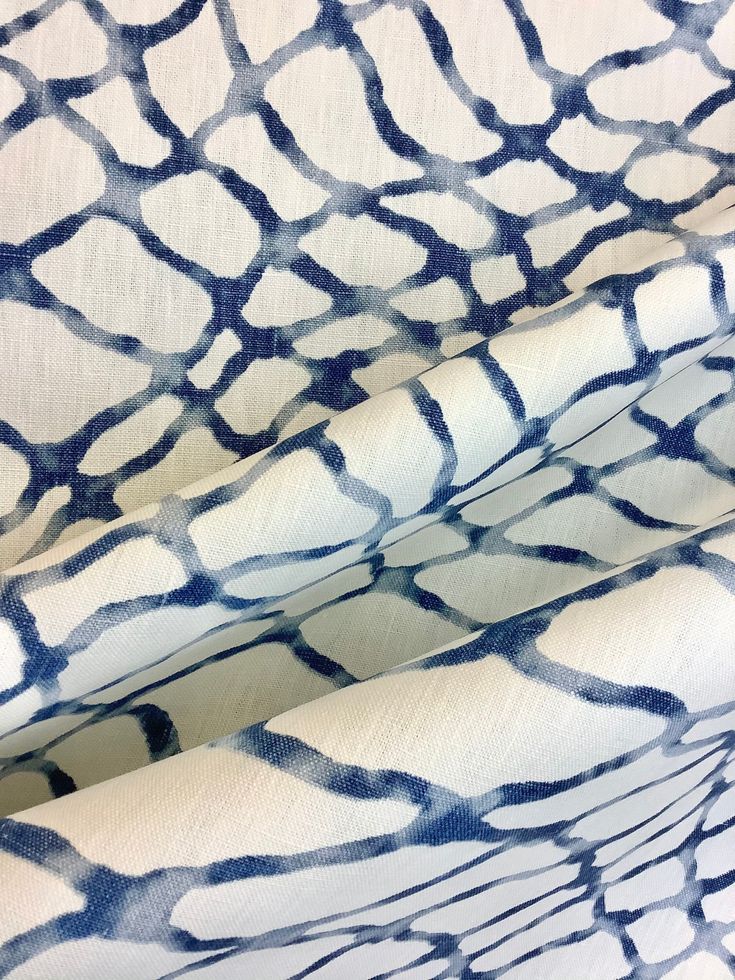 blue and white fabric with an abstract design on the front, as well as in the back