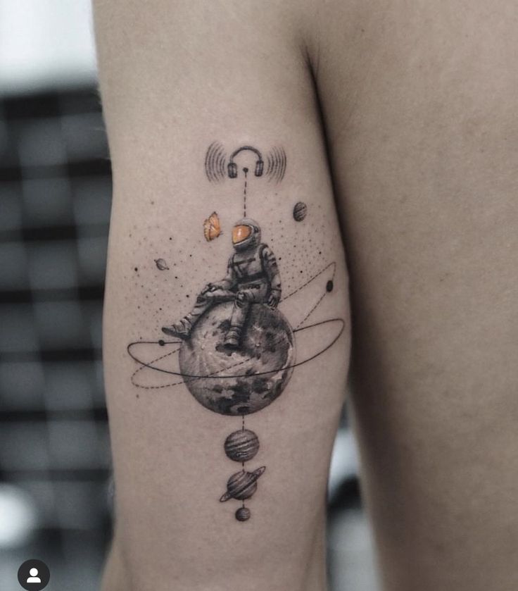 a woman's thigh with an earth and stars tattoo on her left side ribcage