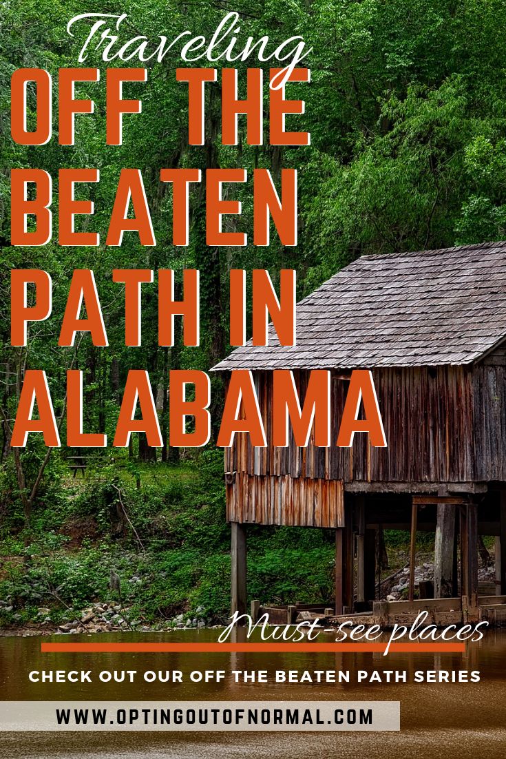 an image of a boathouse with the words traveling off the beaten path in alabama