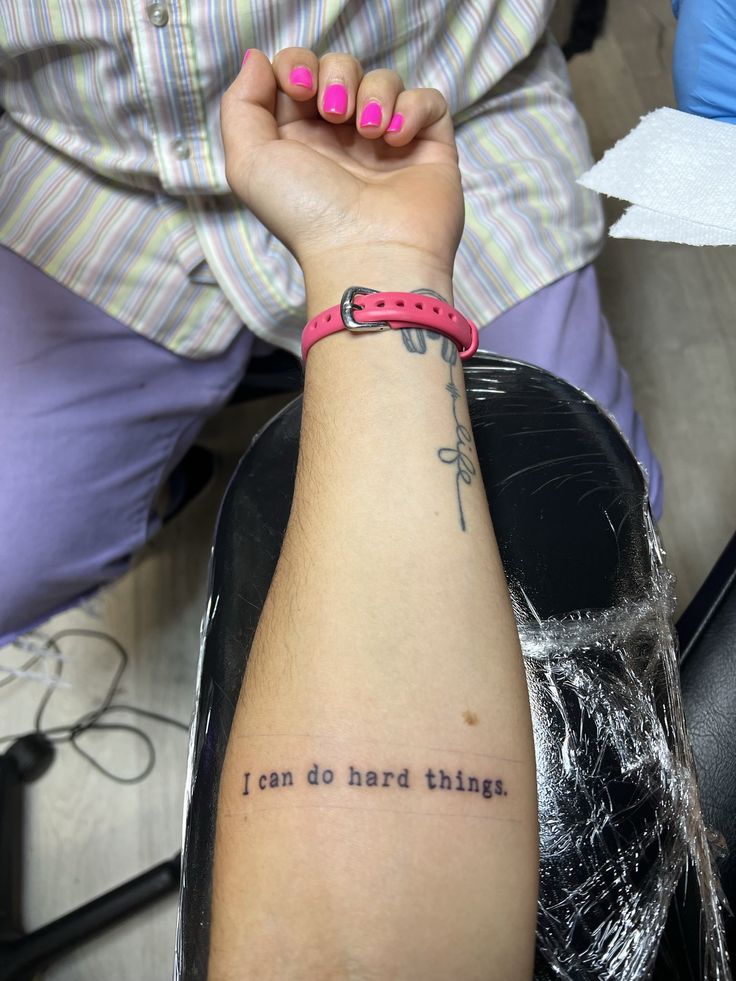 a woman's arm with a tattoo saying i can do hard this