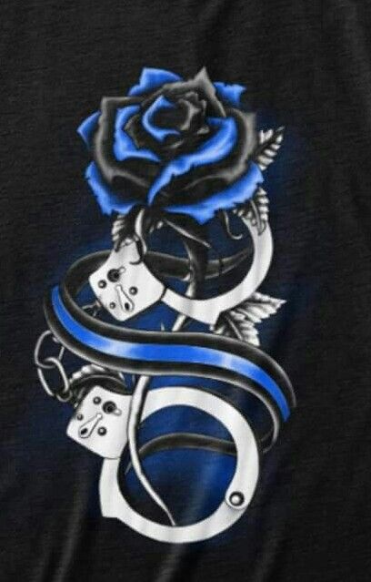 a black shirt with blue roses and handcuffs on it