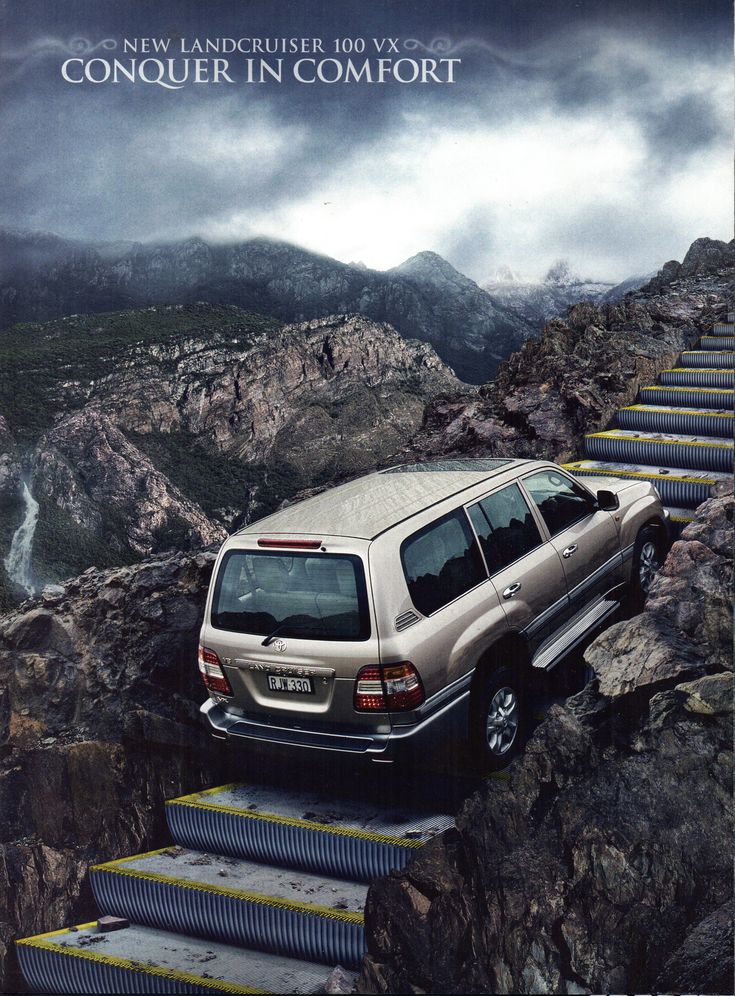 a car is parked on the side of a steep mountain trail with steps leading up to it