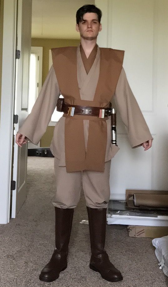 a young man dressed as luke star wars the force awakes in his brown outfit