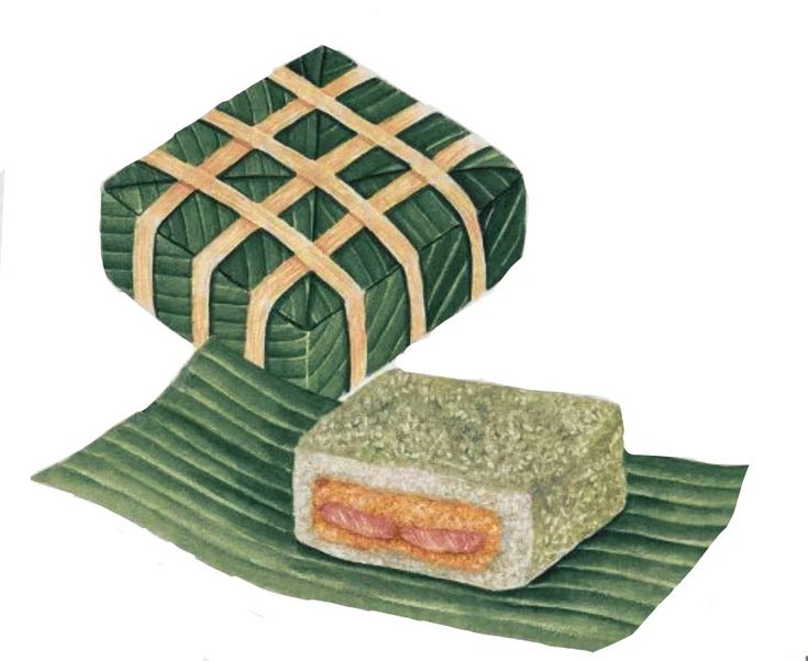 a piece of food sitting on top of a green leaf covered ground next to a box