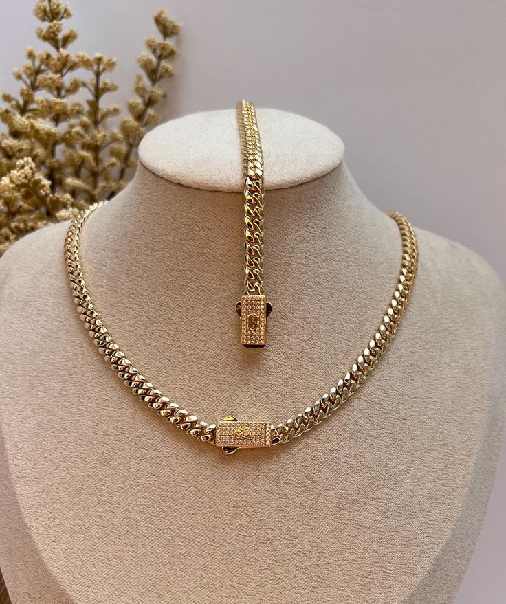 Wearing a cuban chain set is a symbol of luxury, wealth, and success. This beautiful set of Monaco chain and bracelet is designed to fit comfortably on you and to complete your everyday look. ✨DESCRIPTION✨ METAL: Stainless Steel FINISH: 14k gold plated STONE: Cubic Zirconia  WIDTH: 4mm BRACELET LENGTH: 6.5 inches and 7 inches  CHAIN LENGTH: 16 inches and 18 inches   QUALITY: WaterProof, Nickel-free, Hypoallergenic and Tarnish Free COLOR: Gold CLOSURE: BOX ✨JEWELRY CARE QUIDE✨ * Bath with warm so Luxury Diamond Chain Necklaces, Luxury Diamond Chain Necklace For Women, Luxury Diamond Chunky Chain Necklace, Luxury Gold Jewelry For Summer, Custom Luxury Gold Necklaces, Luxury Diamond Jewelry With Chunky Chain, Luxury Diamond Chain Ring As Gift, Luxury Custom Gold Necklaces, Luxury Customized Gold Necklace