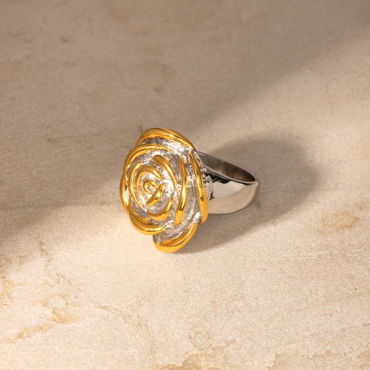 Discover Timeless Elegance with Our Geometric Flower Ring Welcome to our collection of exquisite jewelry! Our Stainless Steel 18K Gold Plated Geometric Flower Ring is a masterpiece that seamlessly blends classic charm with contemporary style. Crafted with precision and passion, this ring is designed to captivate and enchant. Product Features Material: Stainless Steel 18K PVD Gold Plating for Long-Lasting Color Waterproof and Anti-Scratch Nickel, Lead, and Cadmium Free Geometric Design with a Flo Elegant Flower Shaped Ring For Anniversary, Elegant Flower Ring For Anniversary, Elegant Gold Flower Ring, Luxury Gold Rings With Flower Shape, Elegant Flower Ring With Polished Finish For Anniversary, Luxury Gold Flower-shaped Ring, Elegant Gold Flower Ring With Diamond Cut, Luxury Gold Flower Ring For Anniversary, Flower Rings