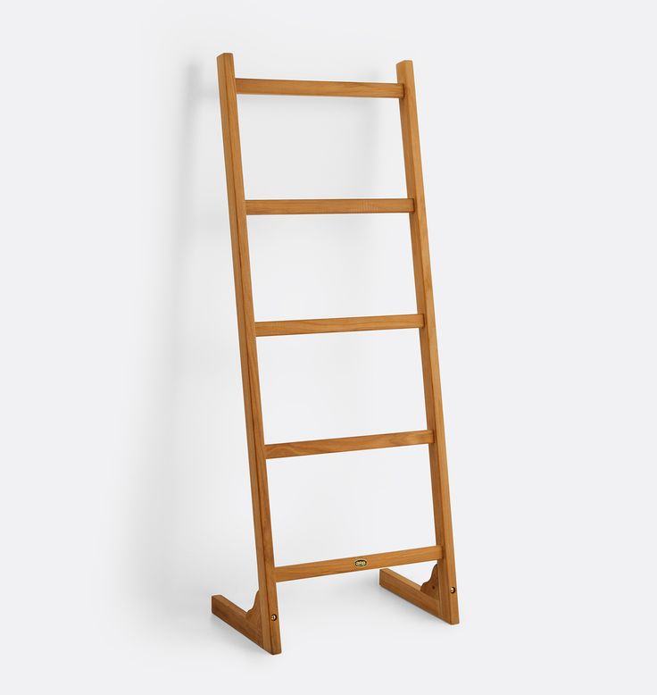 a wooden ladder leaning against a wall with no one on it's legs or feet