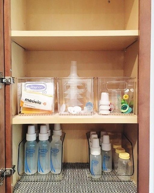 the shelves are filled with bottles and containers for baby care products, including toothpaste