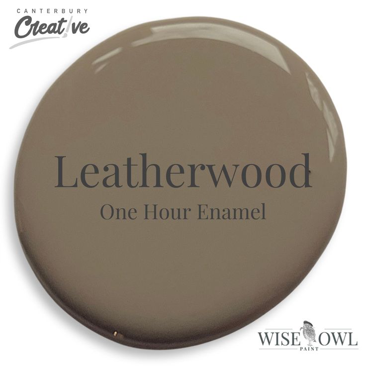 a button with the words leatherwood one hour enamel in black ink on white background