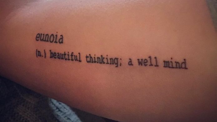 a woman's arm with a tattoo that reads, euodia in beautiful thinking, a well mind