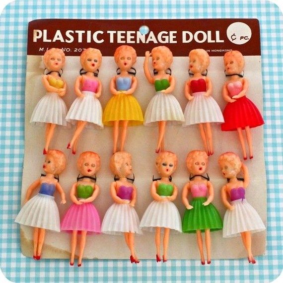 there are many plastic dolls in different outfits