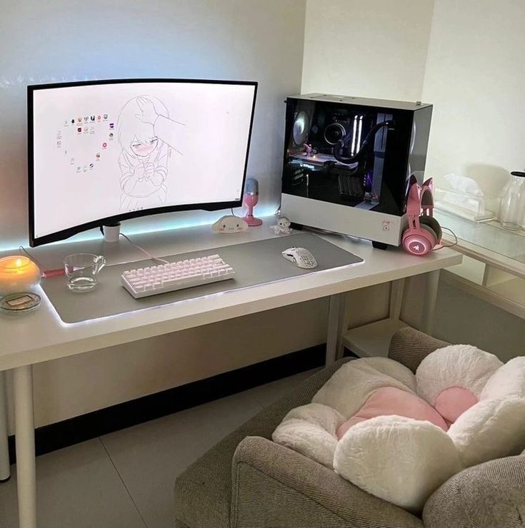 a computer desk with a monitor and keyboard on it