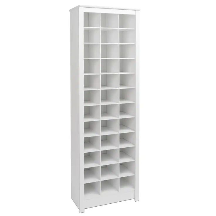 a tall white bookcase with many shelves